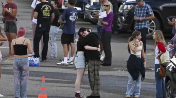 Authorities say student who had been radicalized fired revolver at Colorado school, wounding 2