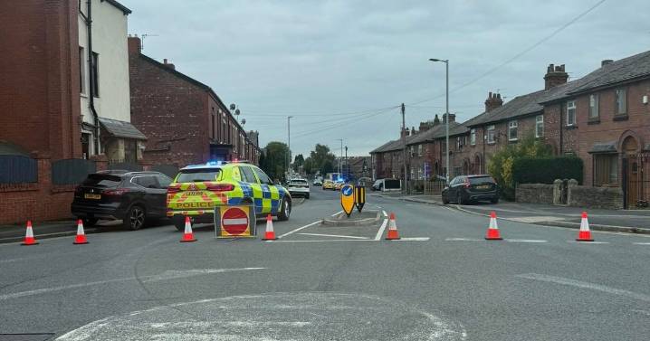 Main road shut off by police after cyclist injured