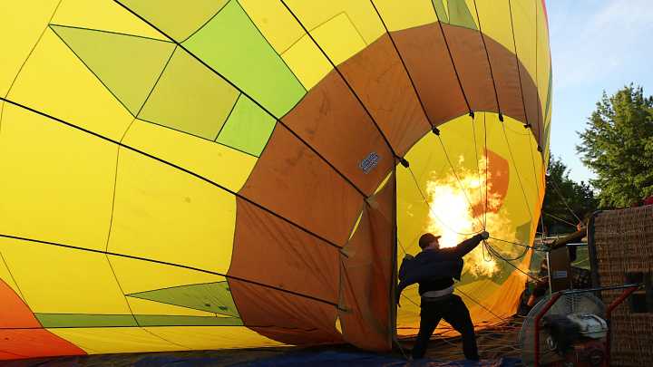Watch dueling balloons during the super glow show at the Great Reno Balloon Race