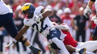 Haynes extends streak of 100-yard rushing games in Michigan victory