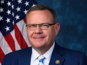 Rep. Moore Publicly Touts Trump Economy, Privately Bets Against It