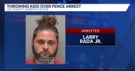 Man arrested for child neglect after being accused of throwing kids over fence