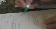 What's up with service charges at some South Florida restaurants?