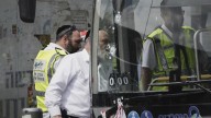 Palestinian gunmen kill 6 people in attack on Jerusalem bus stop