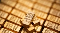 Investors are dumping bonds globally while gold is soaring. Here's why
