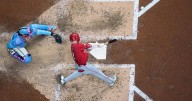 Reds overtake Mets for NL's 3rd wild-card spot by beating Brewers 3