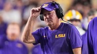 LSU's Brian Kelly gets hit during play