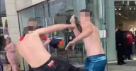 Topless Travellers clash in shopping centre with knives and mops in major feud