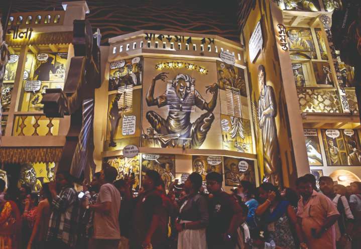 ‘Shasthi’: Puja euphoria drowns deluge fear as revellers flock to pandals