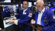 Asian shares are mixed after US stocks remained near record levels following the Fed’s rate cut