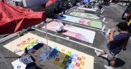 Parking spots used as colorful protest against Florida crackdown on rainbow crosswalks