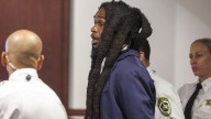 Tampa jury weighs case against 5 men in killing of 4