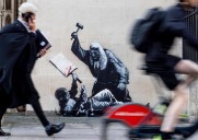 Banksy unveils a new mural of a judge beating a protester outside London court