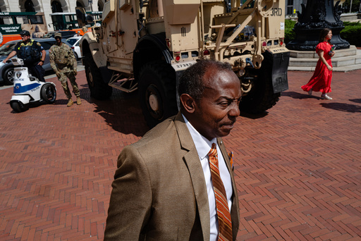 Photos of week three of Washington's federal takeover, as troops on patrol start carrying guns