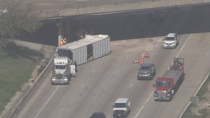 Overturned 18-wheeler impacting traffic on eastbound lanes of Katy Freeway
