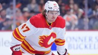 Flames, Connor Zary agree to three