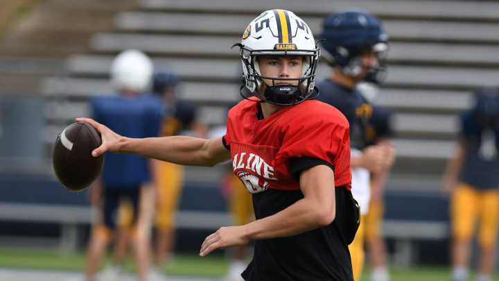 On the football field, Saline's Tommy Carr is nobody's little brother