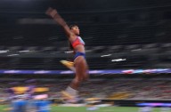 Athletics-Davis-Woodhall adds world long jump title to Olympic crown