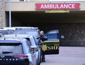 Authorities say student who had been radicalized fired revolver at Colorado school, wounding 2