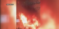 Truck catches fire with driver inside.