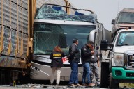Freight train slams into a bus outside Mexico City and kills at least 10 people