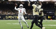Murray throws 2 TD passes to help the Cardinals hold on 20-13 in Saints coach Moore's debut