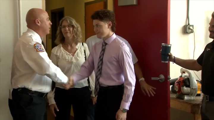 20-year-old rollover wreck survivor reunites with firefighters who saved his life