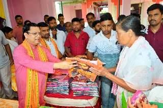 Minister Tinku Roy distributes clothes and shares festive greetings at Chinnamasta Kali Temple
