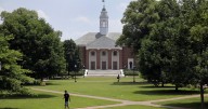 Masked man carrying aerosol can follows Johns Hopkins University affiliate, tries spraying dog
