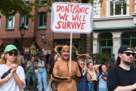 Marchers gather in worldwide protest of financial institutions "profiting off the climate crisis"