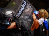Serbian police fire tear gas at protesters demanding end to Vucic rule