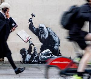 New Banksy mural removed a day after appearing on courthouse