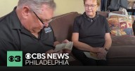 Family members in Delaware County open letters sent by their father during World War II