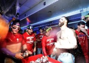 Inside Phillies’ NL East-clinching clubhouse, a familiar celebration that felt different