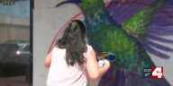 Local artists paint messages of hope in Delmar Maker District as May 16 tornado rebuilding continues