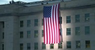 RAW: VA: 9/11: PENTAGON UNFURLS FLAG AT SUNRISE