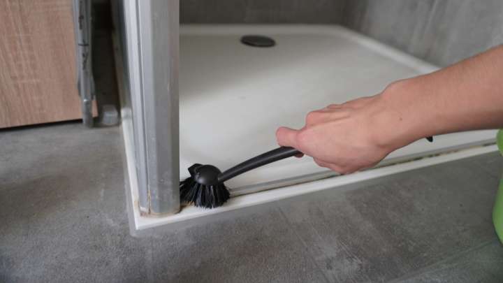 Say Goodbye To Dirty Shower Door Tracks With An Item Hiding In Your Medicine Cabinet