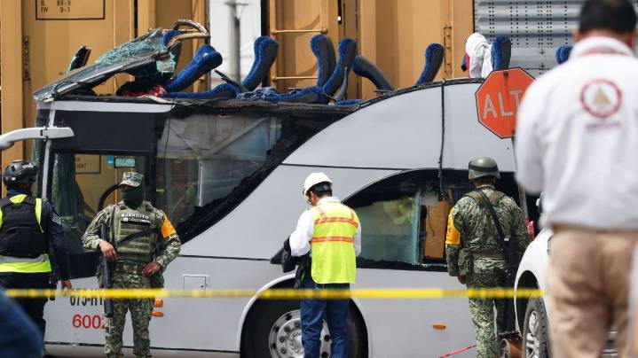 Freight train slams into a bus outside Mexico City and kills at least 10 people