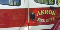 Neighbor rescues pregnant woman from 2nd story window during Akron house fire