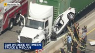 Car wedged between tractor-trailer and concrete median after crash on Route 1 in Morrisville, Bucks County