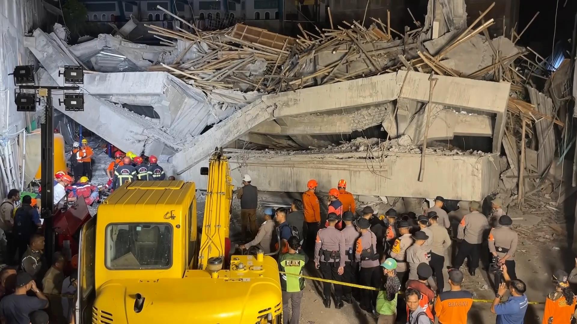 At least 1 dead and dozens of students feared trapped after boarding school collapse in Indonesia
