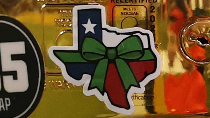 College football teams from Texas honor flood victims with green ribbon sticker