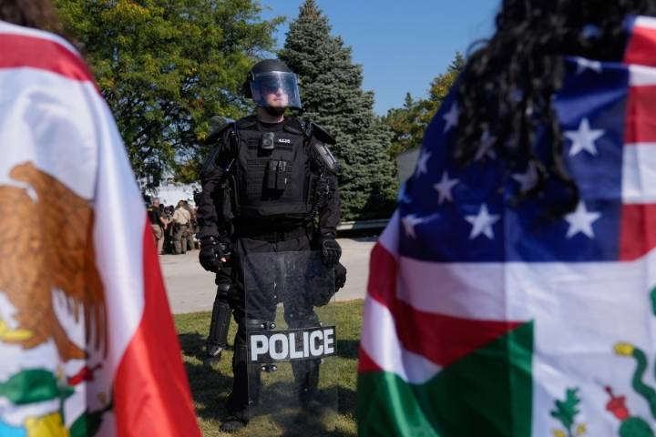 Noem visits Chicago area ICE facility as agents arrest 13, raid city neighborhoods