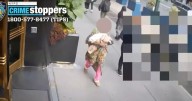 Newborn baby spotted on CCTV carried by woman moments before being left abandoned