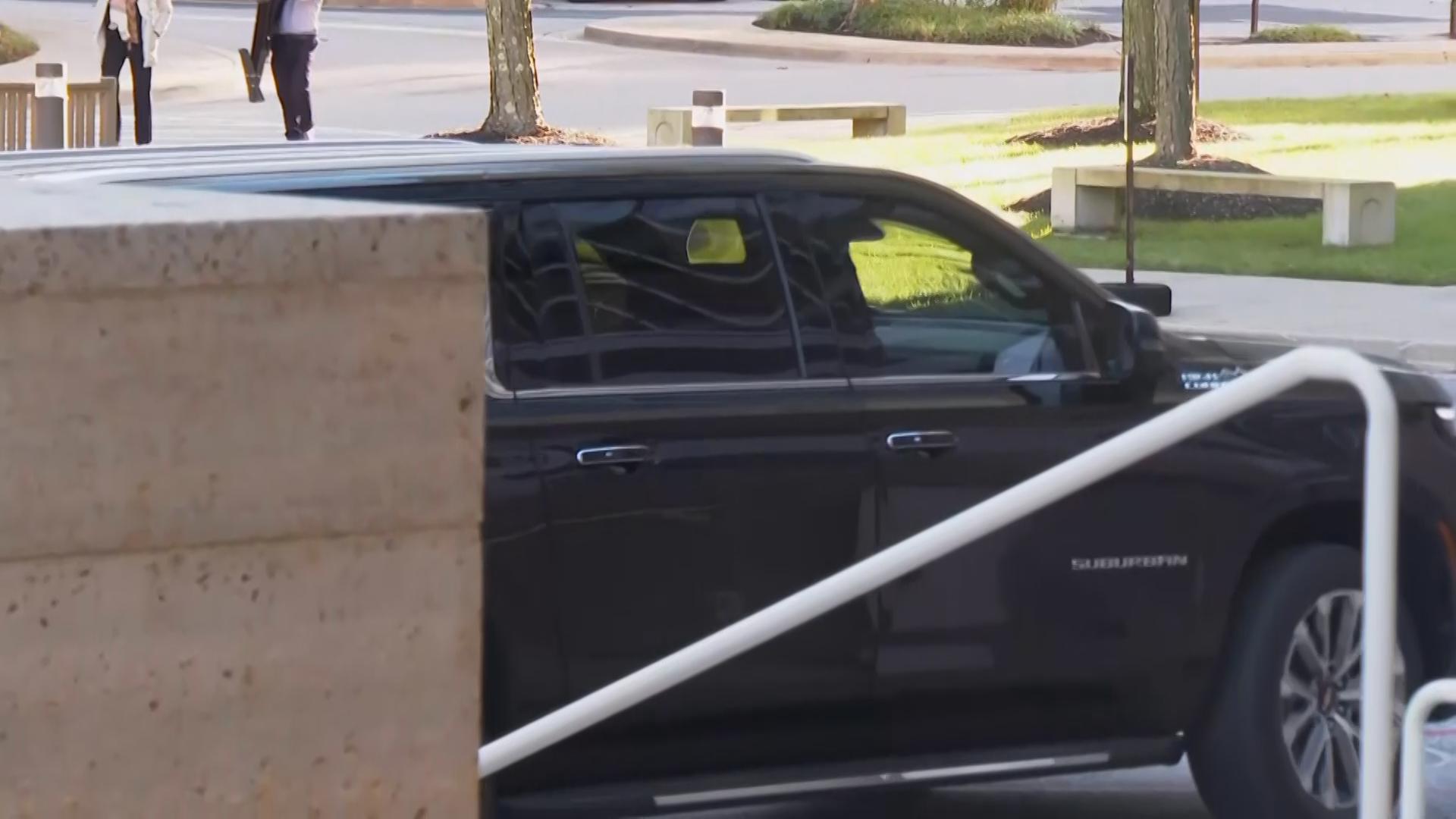 John Bolton arrives at court to surrender to authorities on charges in classified information case