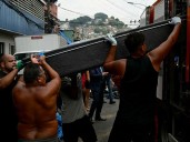 Death toll in Brazilian police drug gang raid rises to 119