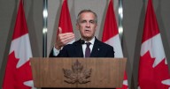 Advocates rally outside PMO, call on Carney to not cut aid