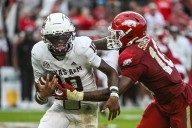 Reed throws for 280 yards and 3 TDs, runs for another score as No. 4 Texas A&M beats Arkansas 45
