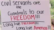 Federal workers, DMV Dems rally outside OMB