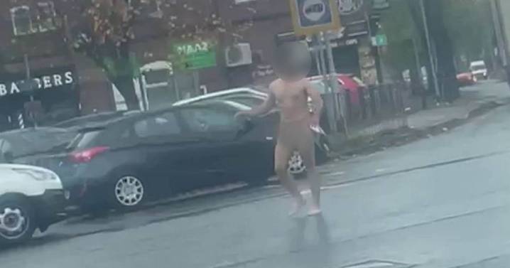 Naked man attacks motorists and tries to pull driver from van in terrifying footage